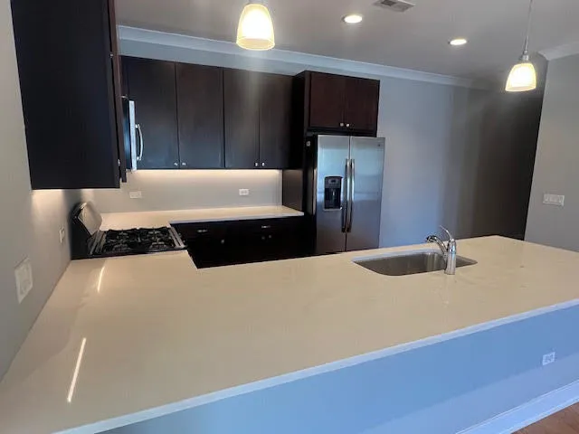 a living room with a bed furniture and a flat screen tv