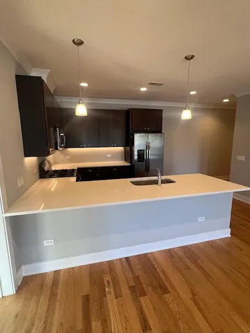 a view of a kitchen with a sink and a dishwasher