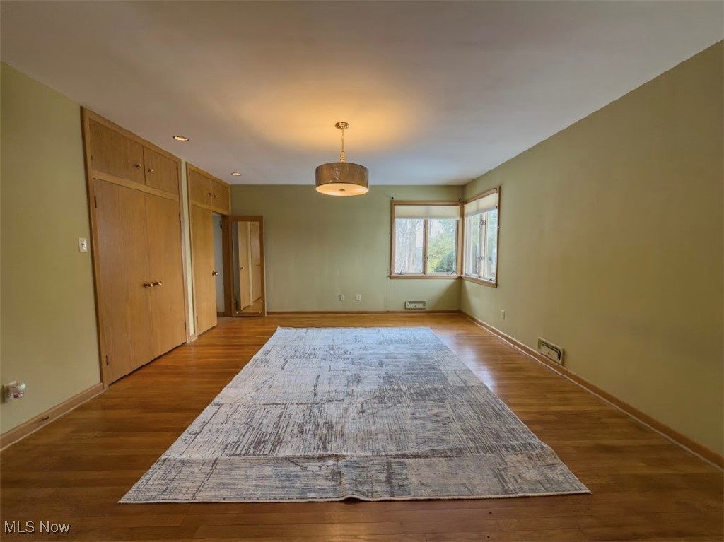7817 Montello Road Independence, OH 44131 - Photo 7 of 35 Unfurnished room with wood-type flooring