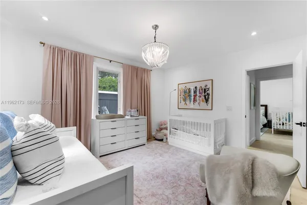 a bedroom with furniture and a window