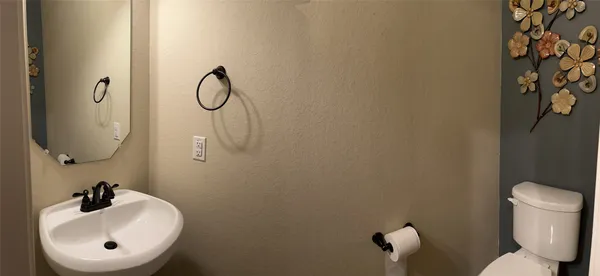 a view of a hallway with entryway door