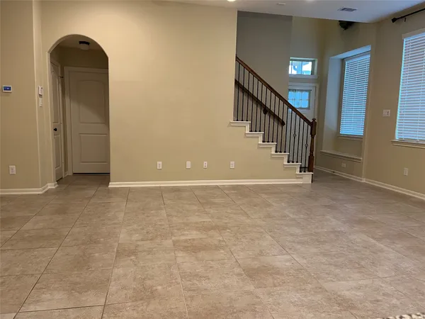 a view of an empty room with windows