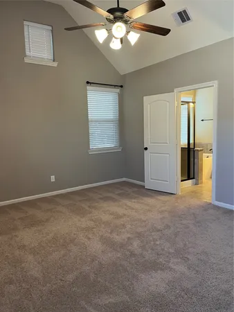 a view of an empty room with a window