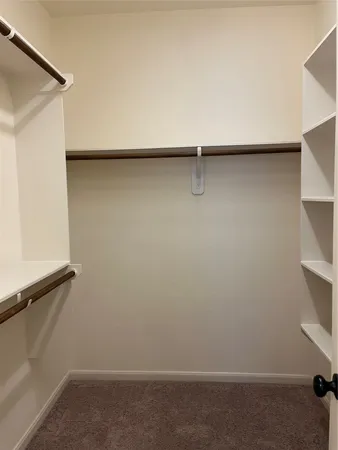 a utility room with sink dryer and washer