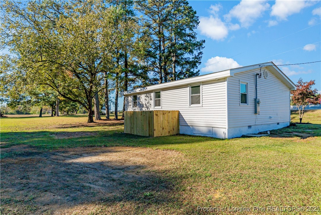1340 George Perry Lee Road Dunn, NC 28334 - Photo 5 of 31 a view of a house with backyard