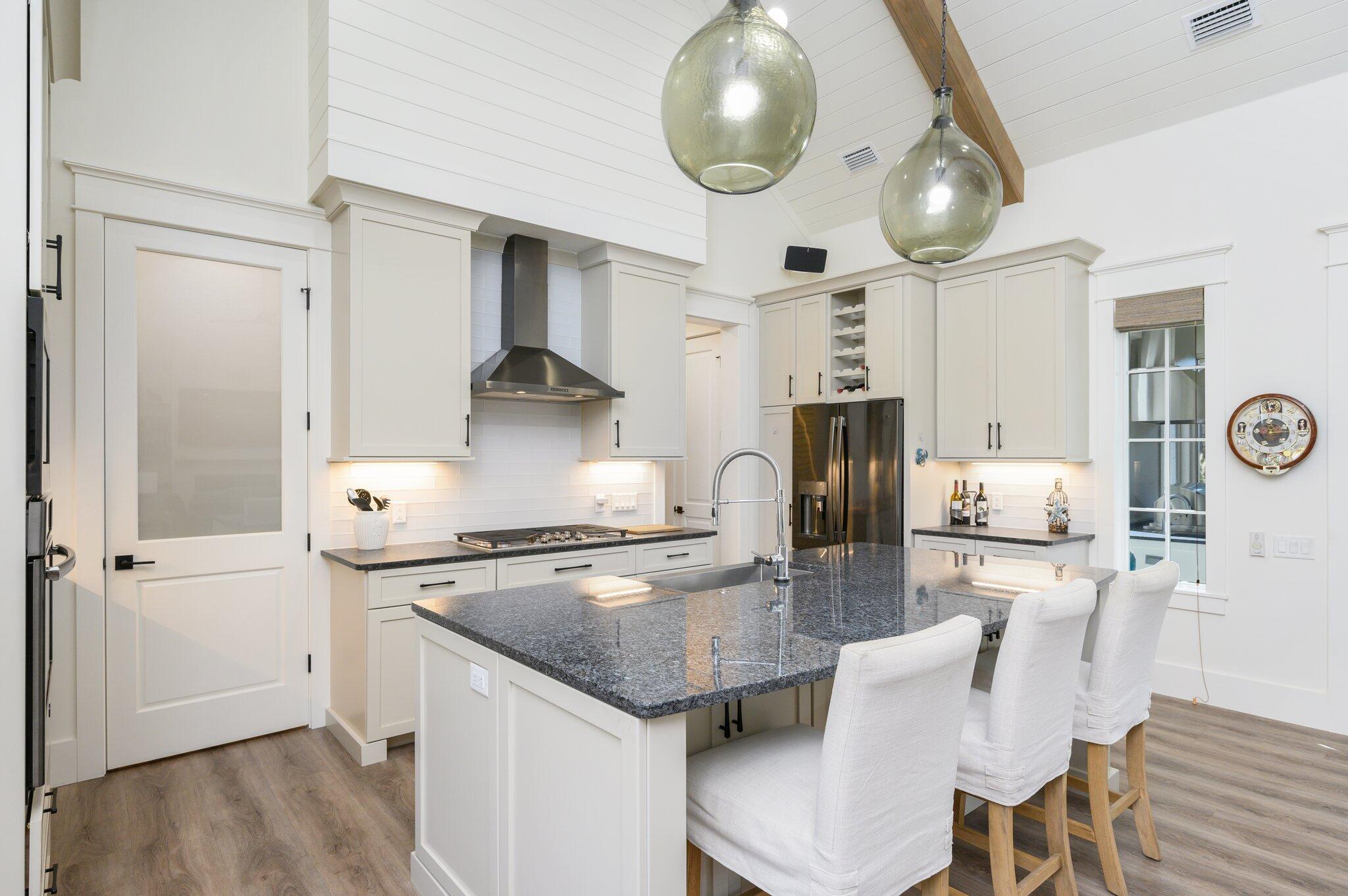 30 Fox Lake Drive Santa Rosa Beach, FL 32459 - Photo 12 of 90 a kitchen with stainless steel appliances granite countertop a stove refrigerator and cabinets