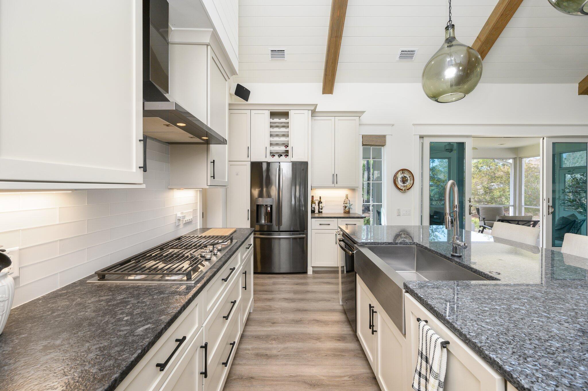 30 Fox Lake Drive Santa Rosa Beach, FL 32459 - Photo 13 of 90 a kitchen with stainless steel appliances granite countertop a lot of counter space and wooden floor