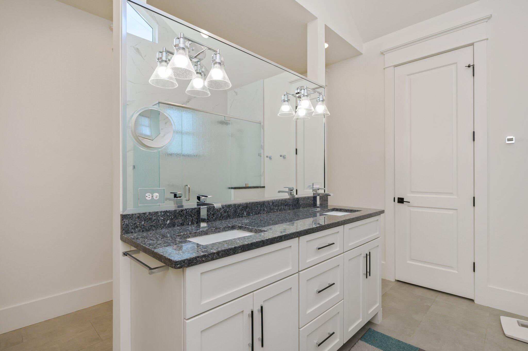 30 Fox Lake Drive Santa Rosa Beach, FL 32459 - Photo 27 of 90 a bathroom with a granite countertop sink a mirror and a vanity