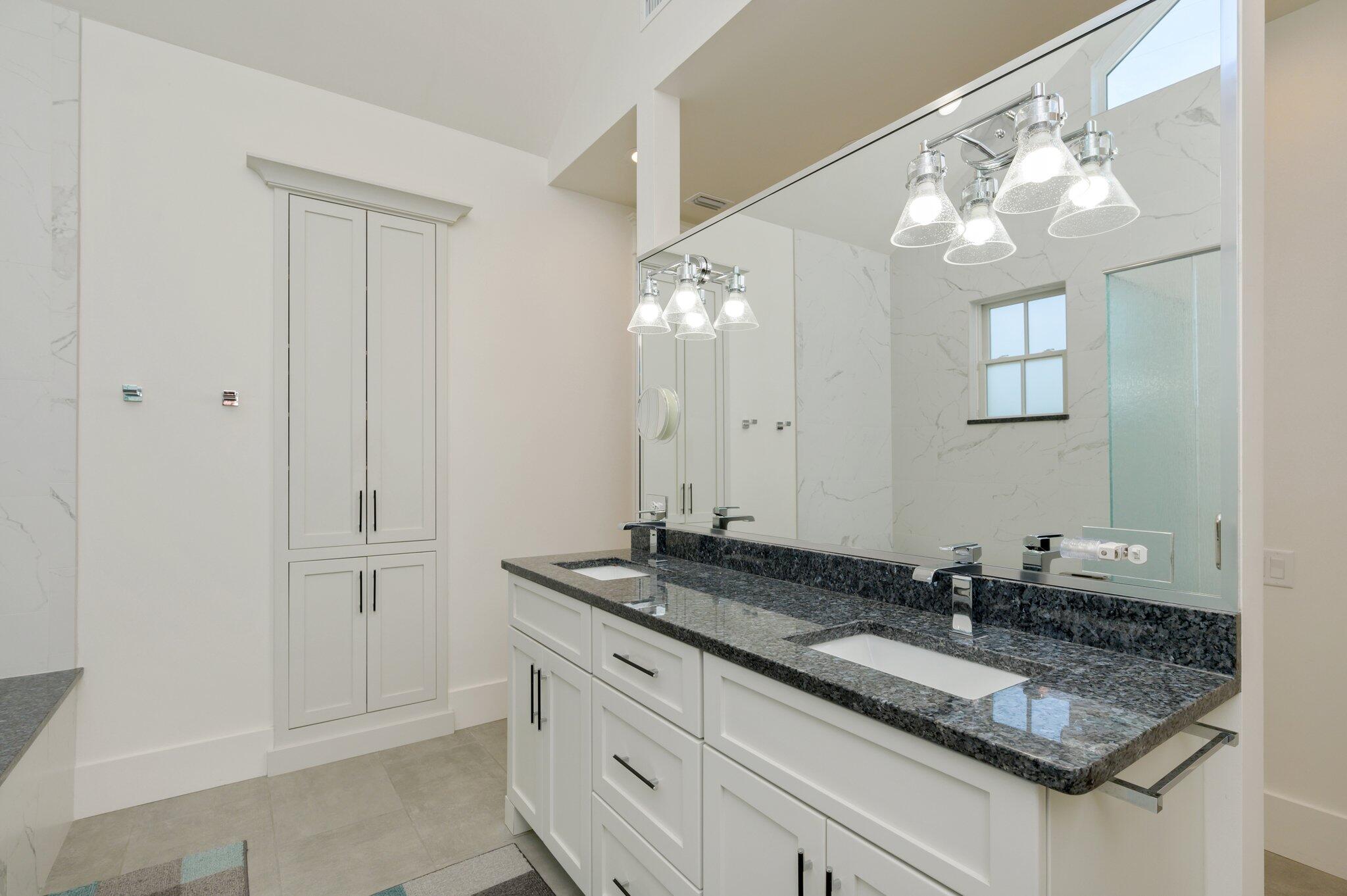 30 Fox Lake Drive Santa Rosa Beach, FL 32459 - Photo 31 of 90 a bathroom with a granite countertop sink and a mirror