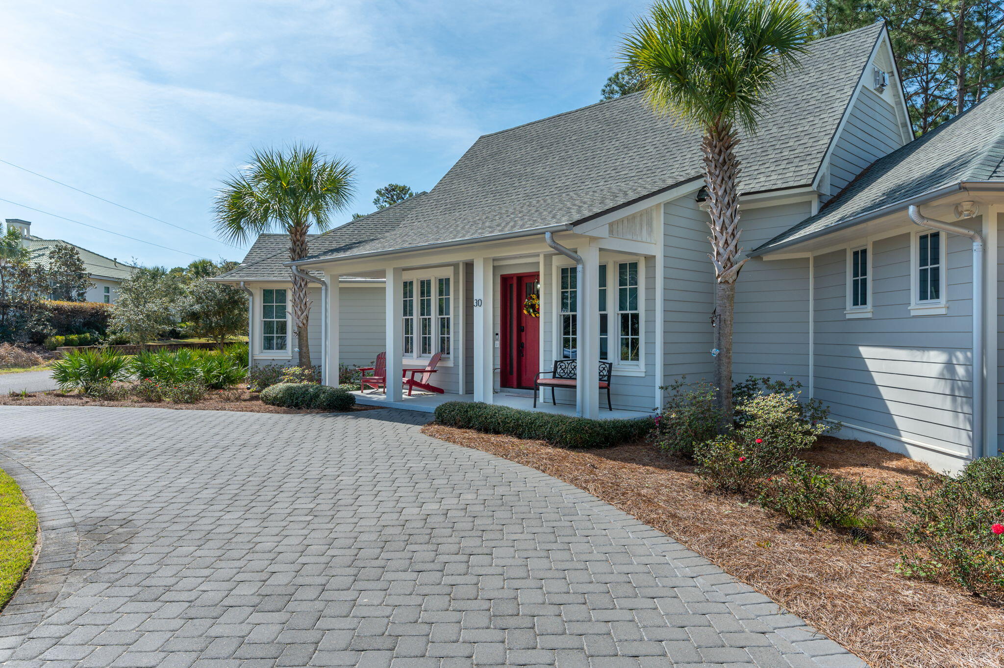30 Fox Lake Drive Santa Rosa Beach, FL 32459 - Photo 68 of 90 a view of a house with brick walls plants and a large tree