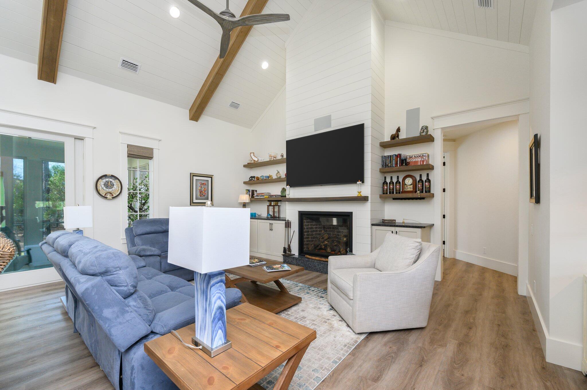 30 Fox Lake Drive Santa Rosa Beach, FL 32459 - Photo 8 of 90 a living room with furniture a fireplace and a flat screen tv