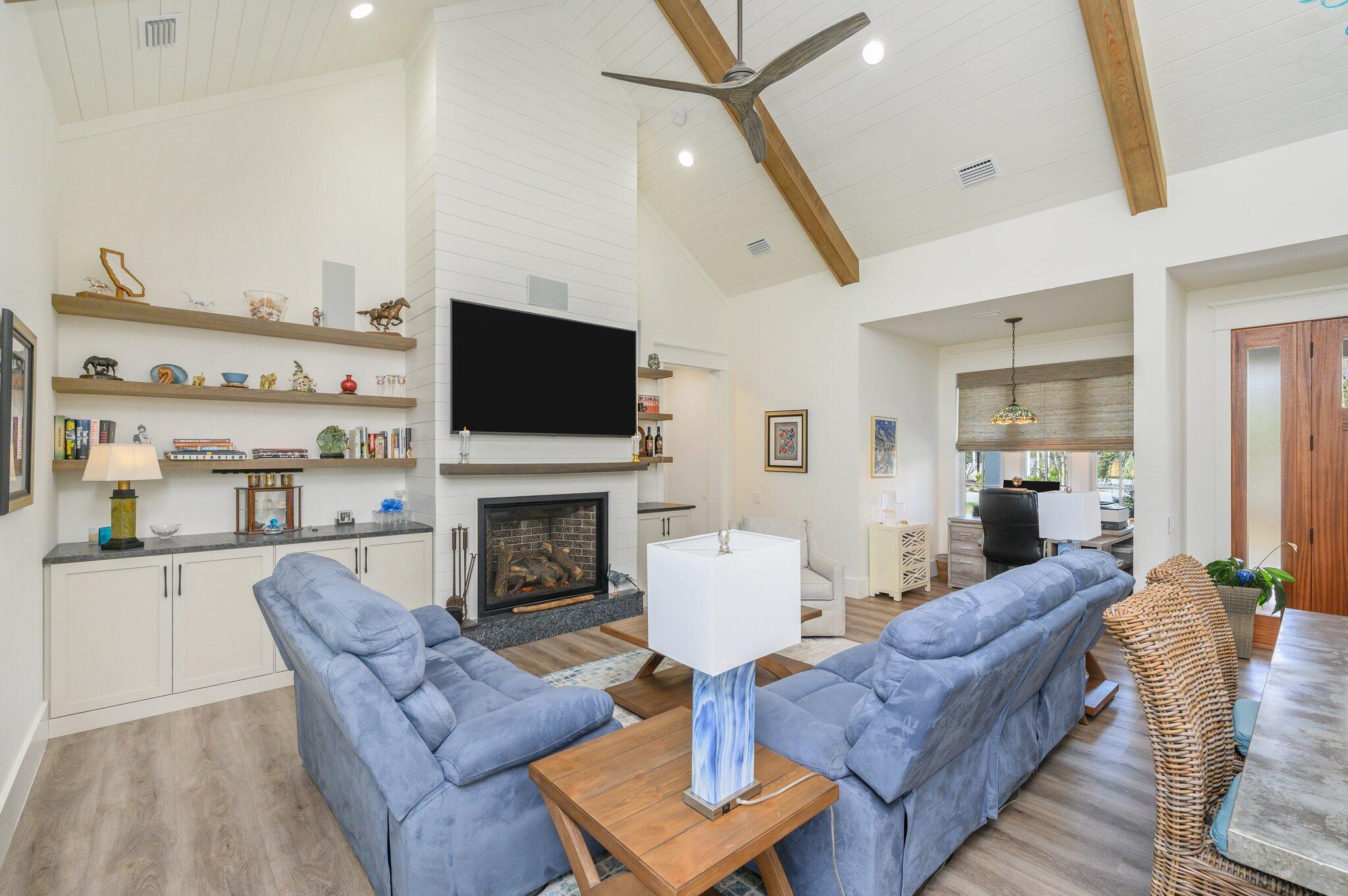 30 Fox Lake Drive Santa Rosa Beach, FL 32459 - Photo 10 of 90 a living room with furniture a fireplace and a flat screen tv