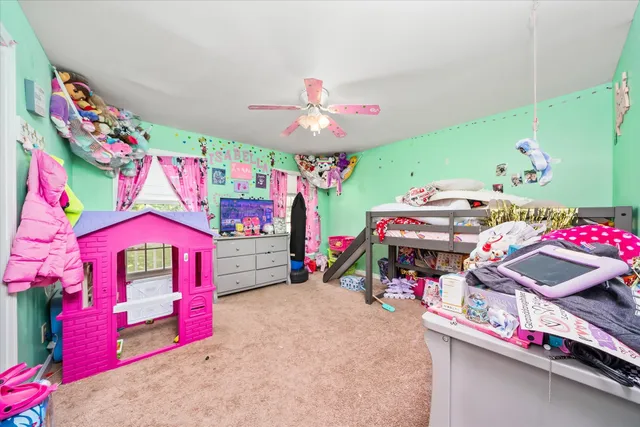 a bed room with a bed and a chandelier