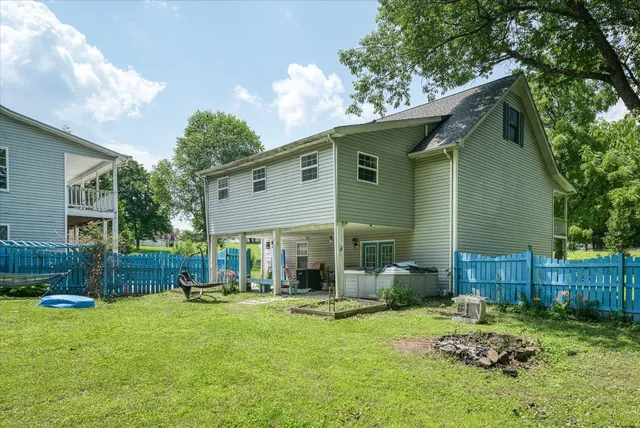 a backyard of a house with outdoor seating and green space