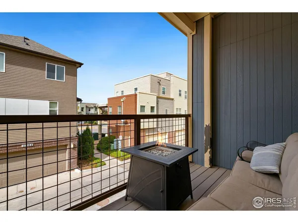 a view of a balcony with furniture