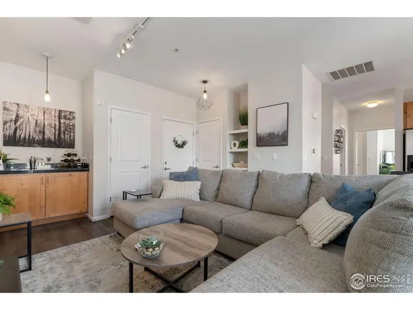 a living room with furniture and a rug