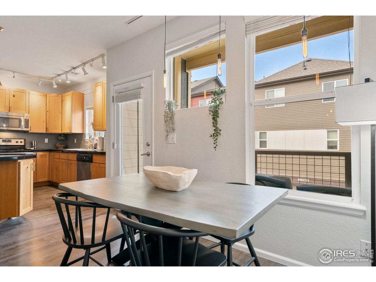 11310 Colony Circle Broomfield, CO 80021 - Photo 6 of 15 a view of a dining room with furniture and window