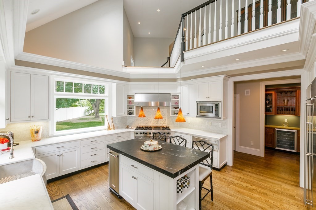79 Oxbow Road Concord, MA 01742 - Photo 11 of 36 a living room with a table chairs and a large window
