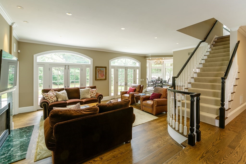 79 Oxbow Road Concord, MA 01742 - Photo 14 of 36 a living room with fireplace furniture and a large window