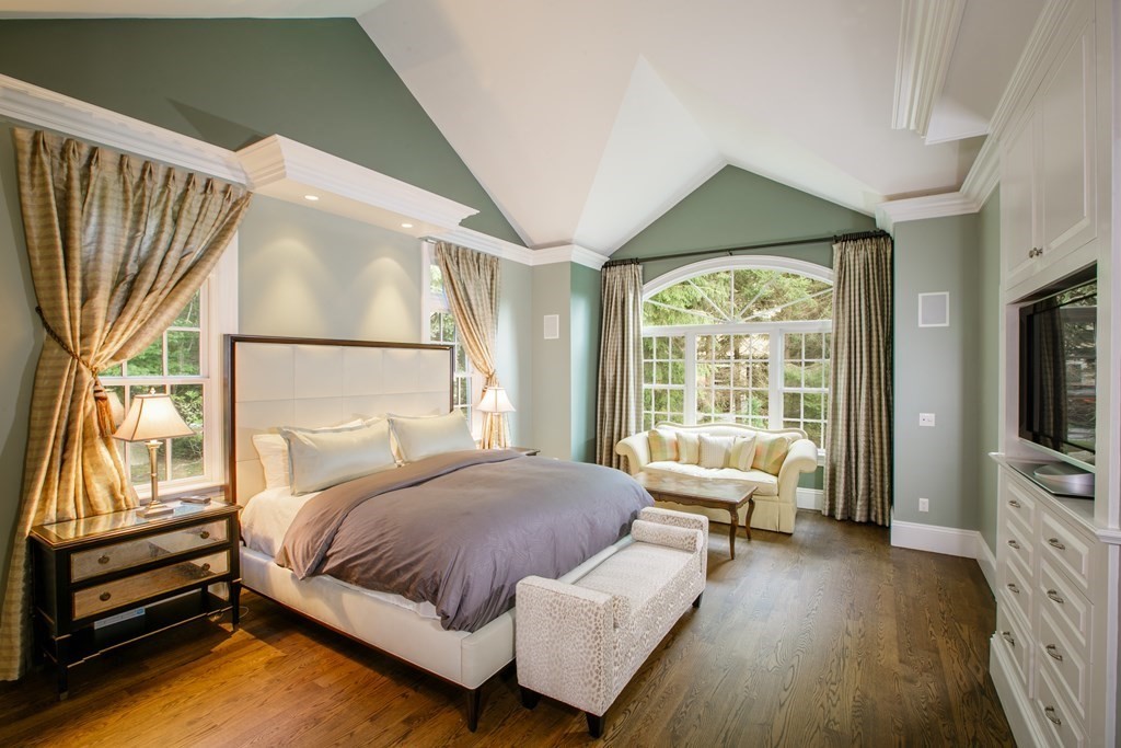 79 Oxbow Road Concord, MA 01742 - Photo 17 of 36 a bedroom with a bed and a flat tv screen on dresser