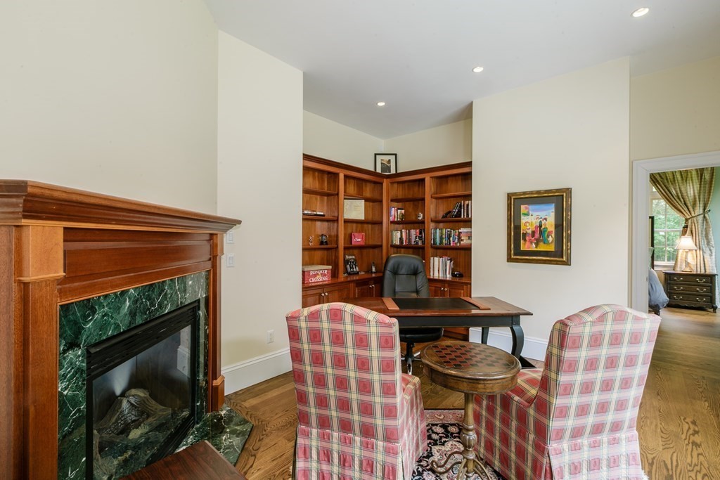 79 Oxbow Road Concord, MA 01742 - Photo 22 of 36 a view of a livingroom with furniture and a fireplace