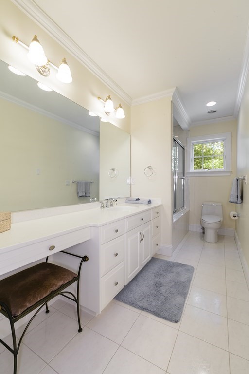 79 Oxbow Road Concord, MA 01742 - Photo 26 of 36 a spacious bathroom with a sink a mirror and a toilet