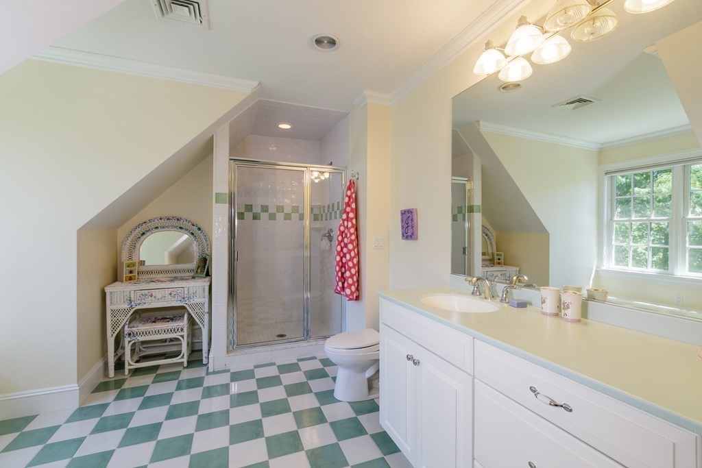 79 Oxbow Road Concord, MA 01742 - Photo 29 of 36 a bathroom with a sink a vanity and a mirror
