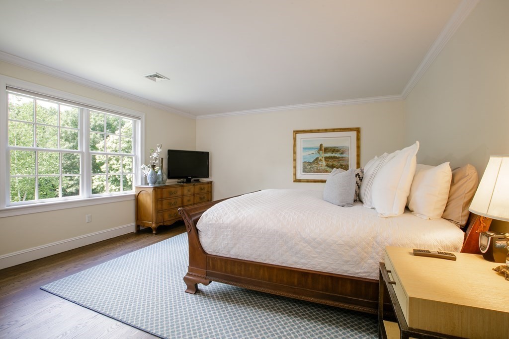 79 Oxbow Road Concord, MA 01742 - Photo 30 of 36 a bedroom with a bed and large window