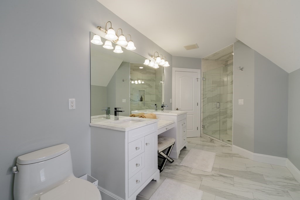 79 Oxbow Road Concord, MA 01742 - Photo 31 of 36 a bathroom with a sink a toilet a mirror a vanity and shower