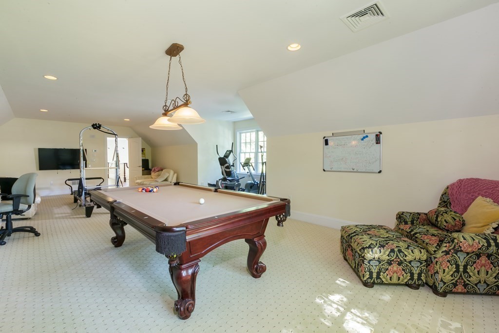 79 Oxbow Road Concord, MA 01742 - Photo 32 of 36 a room with furniture and a flat screen tv