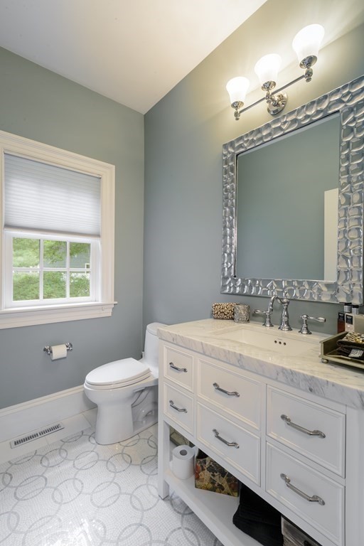 79 Oxbow Road Concord, MA 01742 - Photo 6 of 36 a bathroom with a toilet sink and mirror