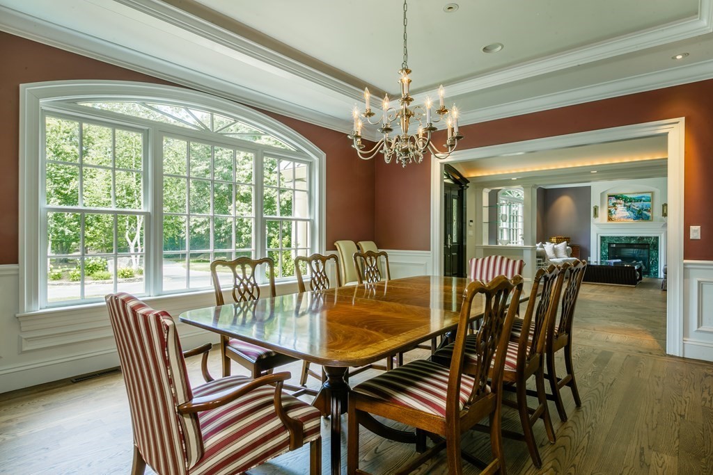 79 Oxbow Road Concord, MA 01742 - Photo 7 of 36 a dining room with furniture a chandelier and wooden floor