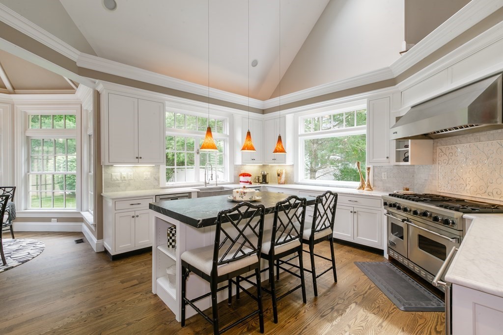 79 Oxbow Road Concord, MA 01742 - Photo 10 of 36 a kitchen with a stove a sink and a refrigerator
