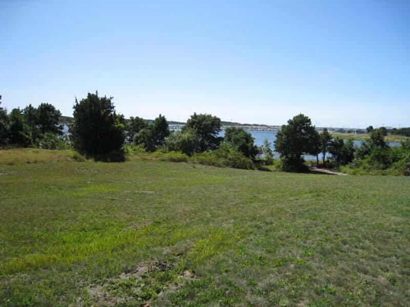 125 Pine Point Road Wellfleet, MA 02667 - Photo 15 of 49 a view of a field with trees in background