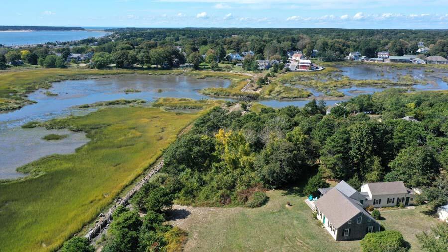125 Pine Point Road Wellfleet, MA 02667 - Photo 23 of 49 a view of a lake with houses