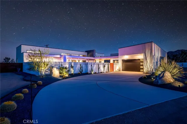 a room with furniture and a floor to ceiling window