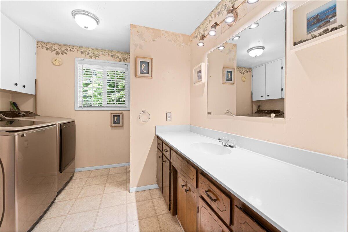 4093 Old Upton Road Central Point, OR 97502 - Photo 19 of 23 a spacious bathroom with a double vanity sink a mirror and a shower