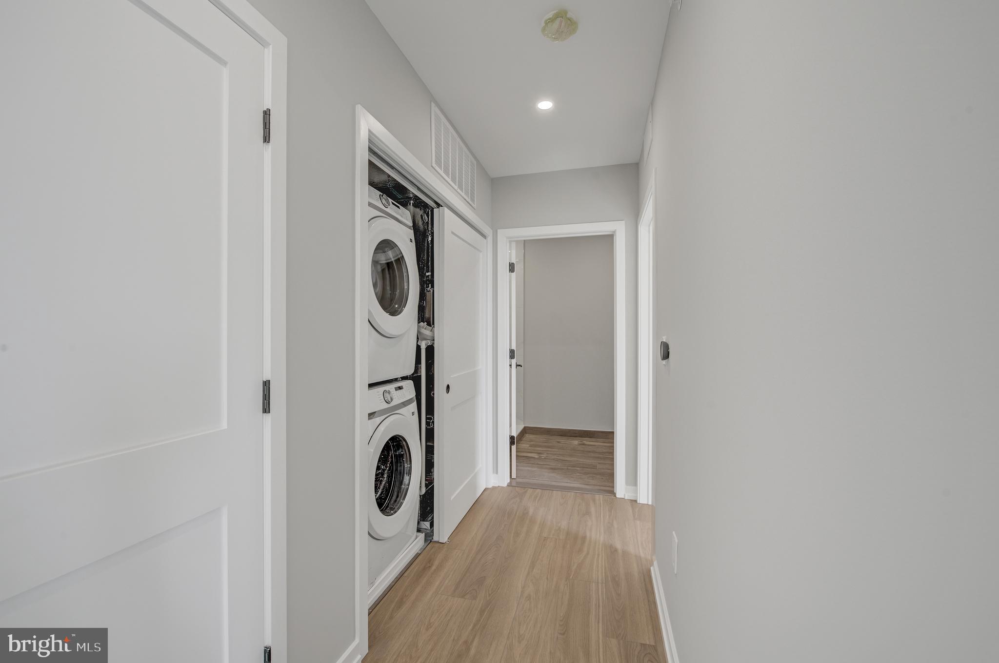 2445 Innovator Way, Unit 4G Philadelphia, PA 19146 - Photo 7 of 32 a view of a hallway with washer and dryer