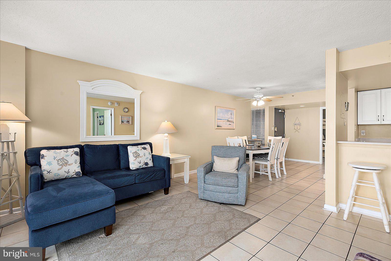 502 Island House Road Bethany Beach, DE 19930 - Photo 11 of 56 a living room with furniture and a table