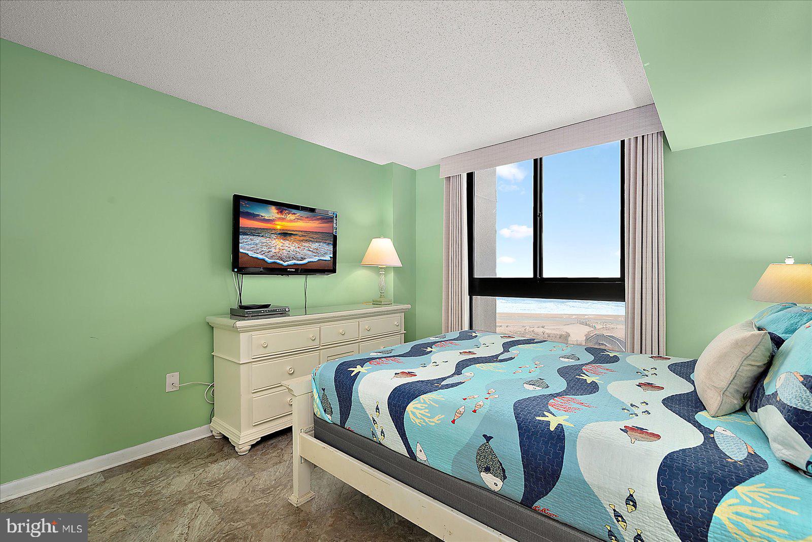 502 Island House Road Bethany Beach, DE 19930 - Photo 22 of 56 a bedroom with a bed and a flat screen tv