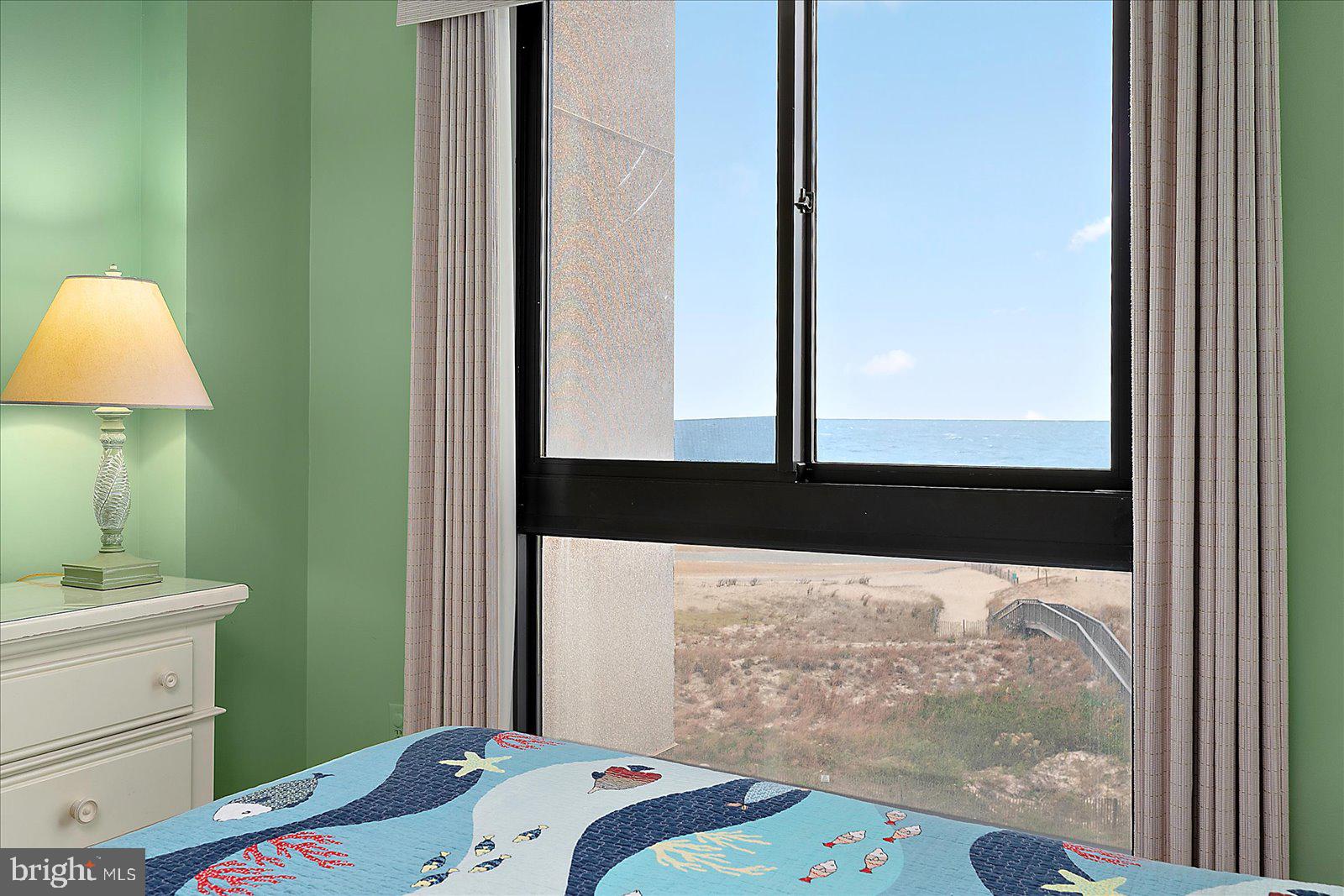 502 Island House Road Bethany Beach, DE 19930 - Photo 23 of 56 a bedroom with a bed and a window