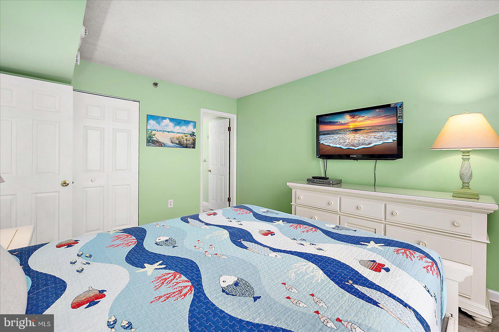 502 Island House Road Bethany Beach, DE 19930 - Photo 25 of 56 a bedroom with a bed and a flat screen tv