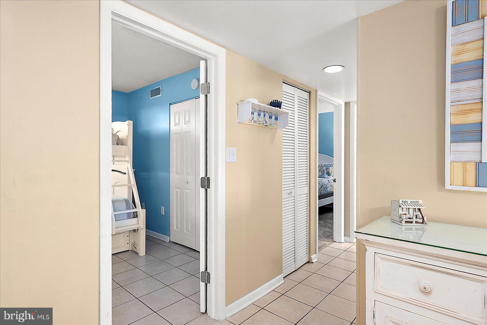 502 Island House Road Bethany Beach, DE 19930 - Photo 27 of 56 a view of a hallway with closet and a living room