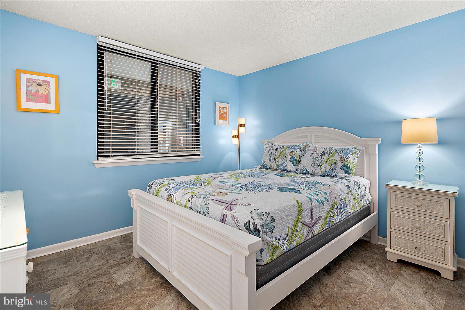 502 Island House Road Bethany Beach, DE 19930 - Photo 28 of 56 a bedroom with a bed and a window