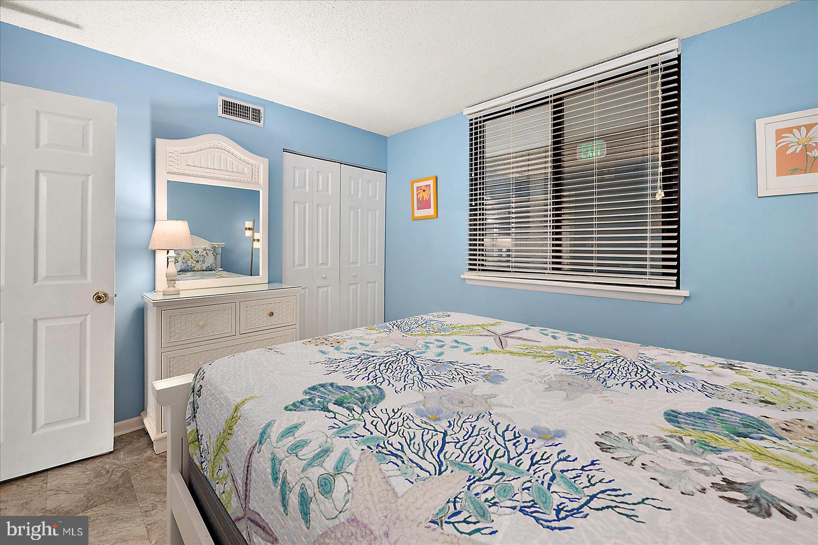 502 Island House Road Bethany Beach, DE 19930 - Photo 29 of 56 a bedroom with a bed and a window