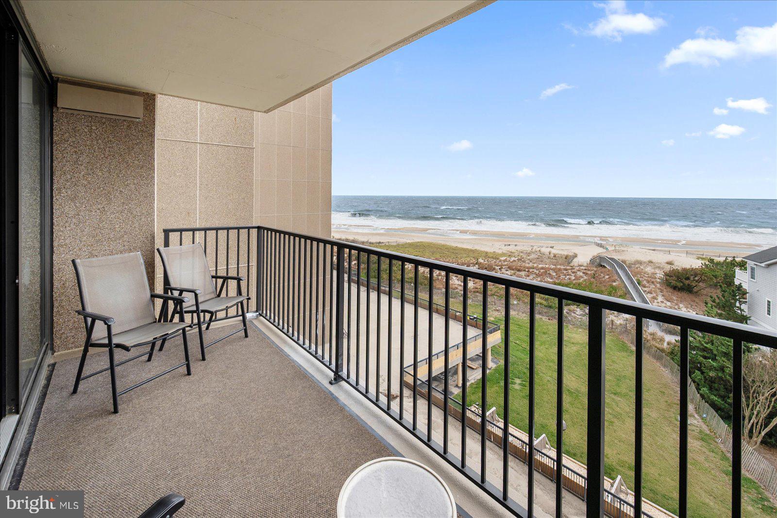 502 Island House Road Bethany Beach, DE 19930 - Photo 3 of 56 a view of a balcony with chairs