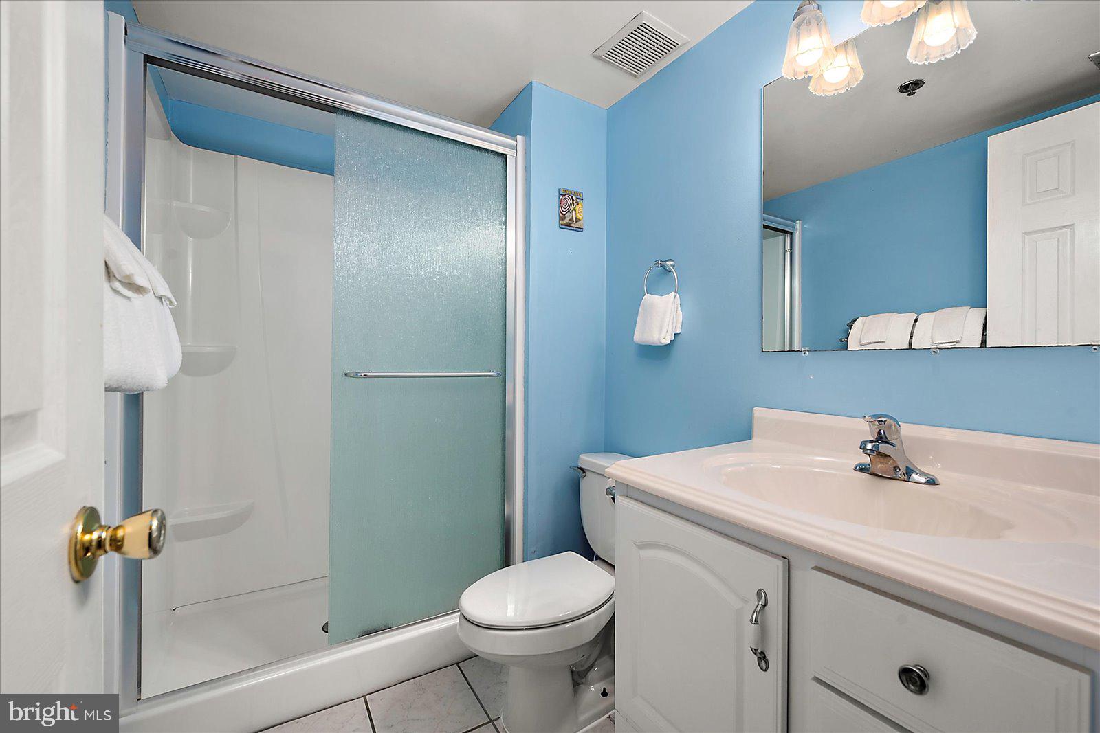 502 Island House Road Bethany Beach, DE 19930 - Photo 31 of 56 a bathroom with a sink toilet and shower