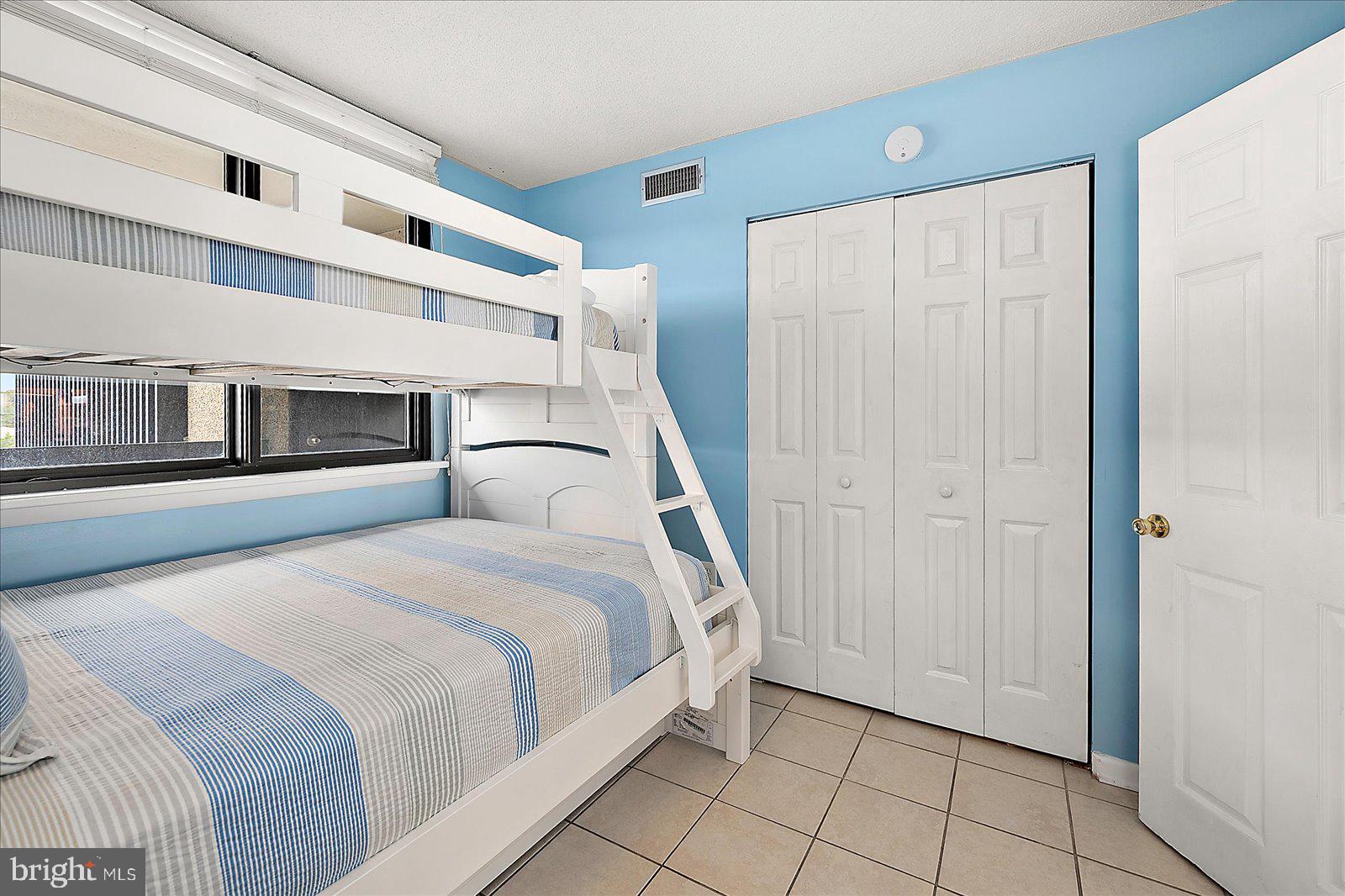 502 Island House Road Bethany Beach, DE 19930 - Photo 33 of 56 a bedroom with a bed and a window