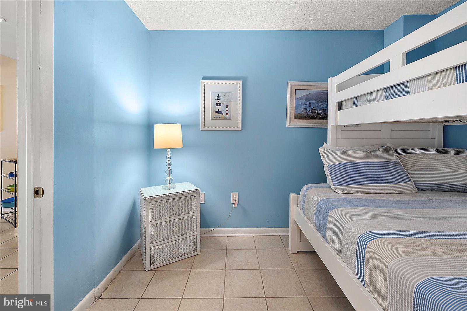 502 Island House Road Bethany Beach, DE 19930 - Photo 34 of 56 a bedroom with a bed and a window