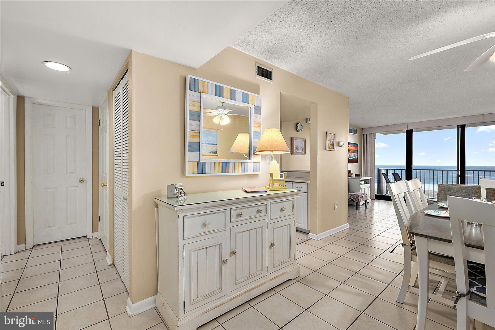 502 Island House Road Bethany Beach, DE 19930 - Photo 6 of 56 a dining hall with stainless steel appliances granite countertop a stove and a sink